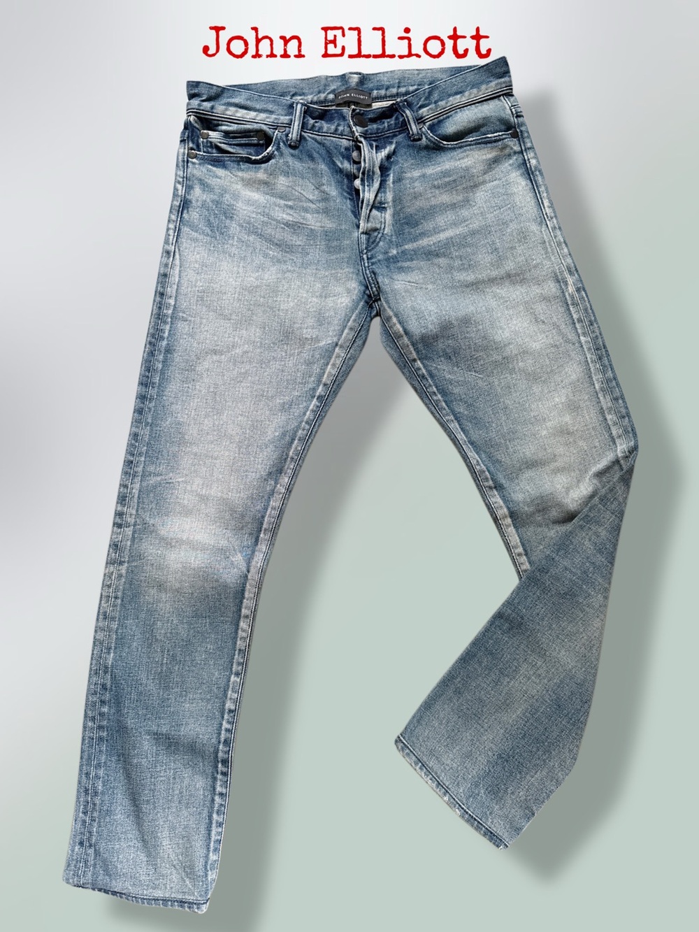 JOHN ELLIOTT 
washed-effect denim jeans with a button fly